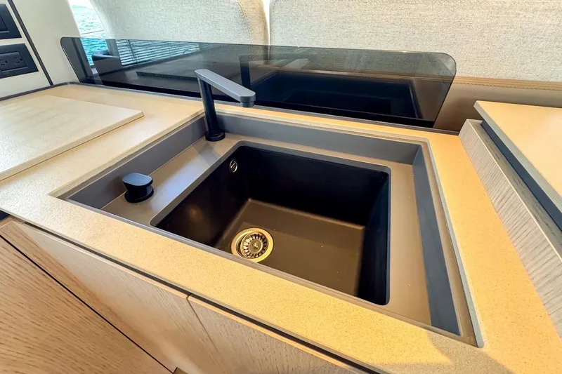 Slide: The Image of Modern kitchen sink on 2024 Ferretti Yachts 580, featuring sleek design and high-end fixtures. - 25