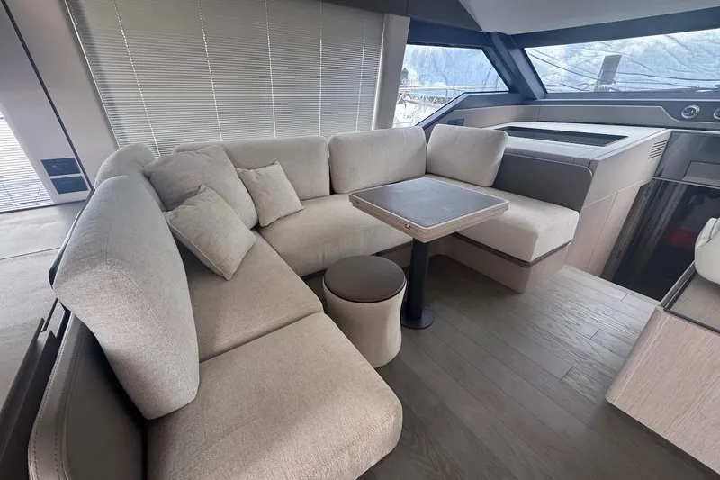 Slide: The Image of Luxurious interior of 2024 Ferretti Yachts 580 with elegant seating and modern design. - 26