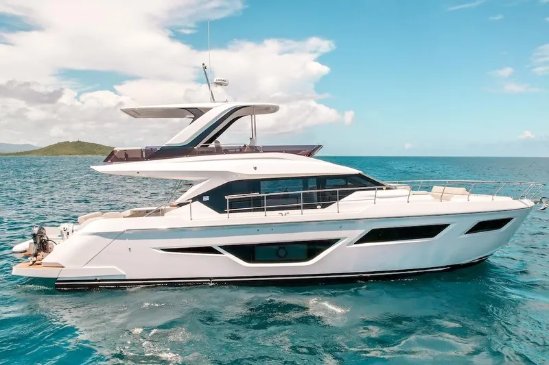 Slide: The Image of 2024 Ferretti Yachts 580 cruising on clear blue ocean waters. - 3