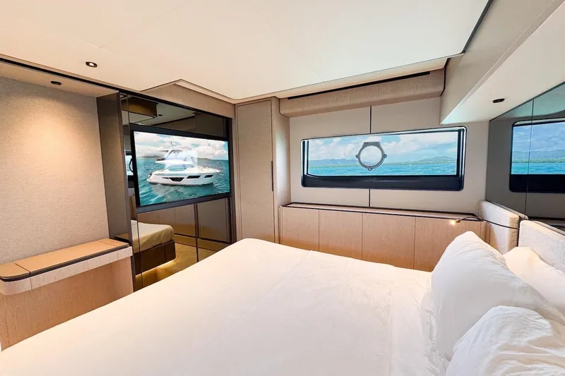 Slide: The Image of Luxurious bedroom interior of 2024 Ferretti Yachts 580, featuring modern design and ocean view. - 34