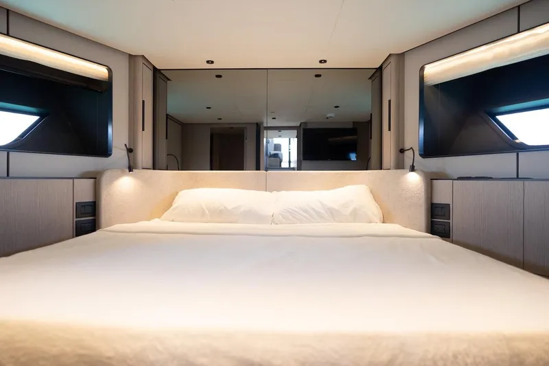 Slide: The Image of Luxurious bedroom interior of 2024 Ferretti Yachts 580, featuring modern design and ambient lighting. - 40