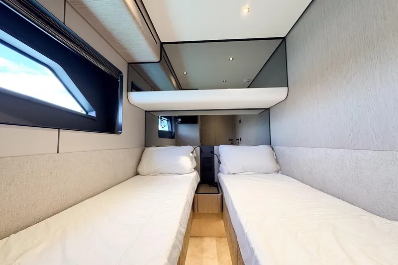 Slide: The Image of Luxurious twin cabin interior of 2024 Ferretti Yachts 580, featuring modern design and comfort. - 43