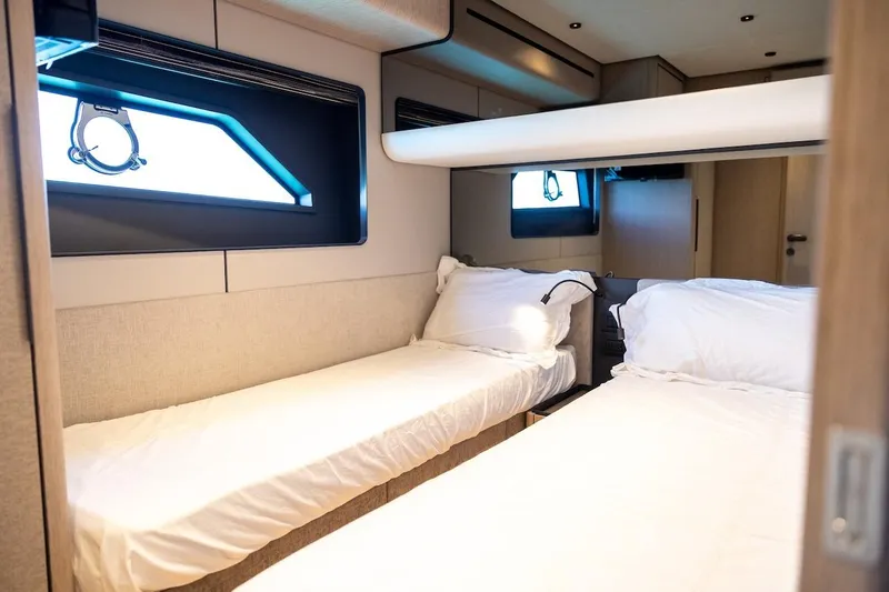 Slide: The Image of Luxurious twin cabin interior of 2024 Ferretti Yachts 580, featuring modern design and comfort. - 44