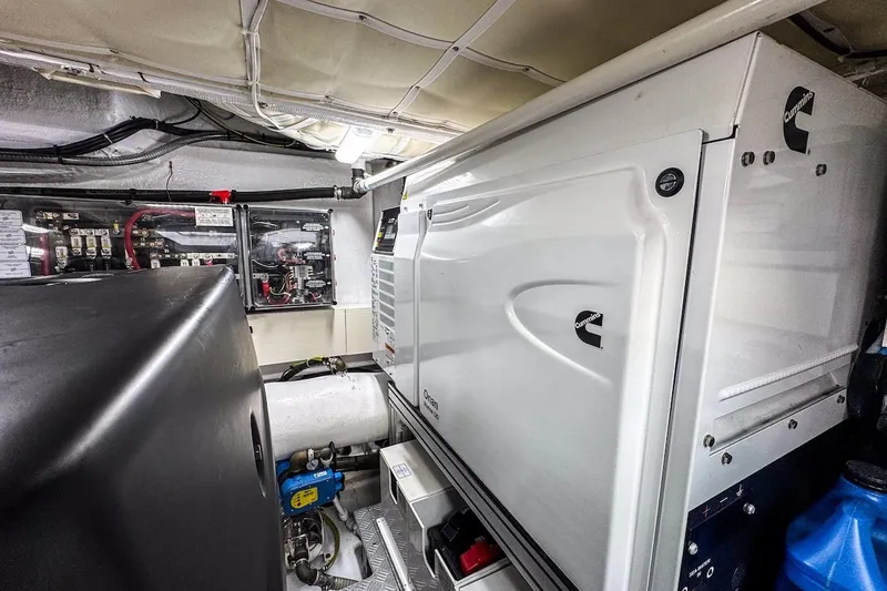 Slide: The Image of Engine room of 2024 Ferretti Yachts 580, featuring Cummins generator and electrical systems. - 54