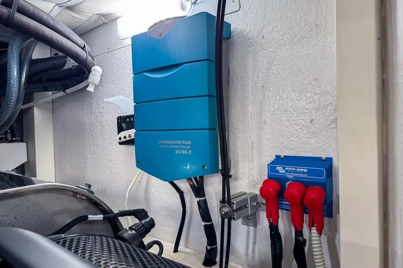 Slide: The Image of Engine room of 2024 Ferretti Yachts 580 with battery charger and wiring. - 57