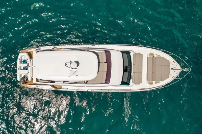 Slide: The Image of Aerial view of 2024 Ferretti Yachts 580 on clear blue water. - 9