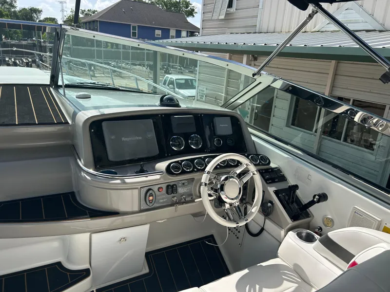 Slide: The Image of 2004 Formula 400 SS boat cockpit with modern controls and steering wheel. - 12