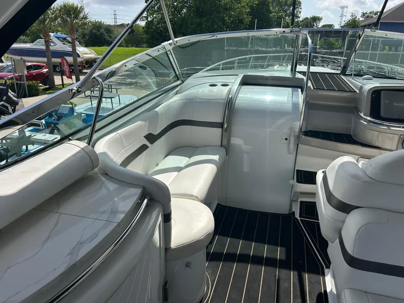 Slide: The Image of Luxurious interior of a 2004 Formula 400 SS boat with white seating and sleek design. - 14