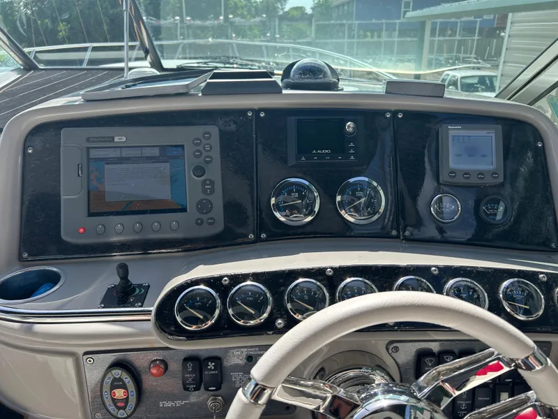 Slide: The Image of Dashboard of a 2004 Formula 400 SS boat with navigation and control instruments. - 15