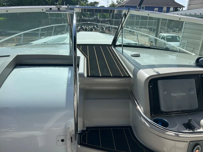 Slide: The Image of 2004 Formula 400 SS boat cockpit with navigation equipment and sleek design. - 17