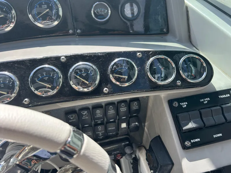 Slide: The Image of Dashboard of a 2004 Formula 400 SS boat with gauges and controls. - 18