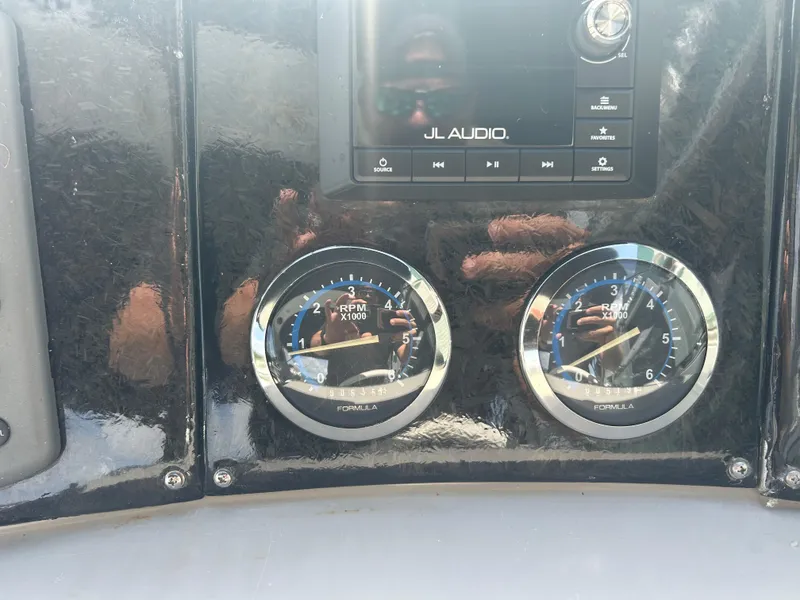 Slide: The Image of Dashboard of a 2004 Formula 400 SS with JL Audio system and RPM gauges. - 21