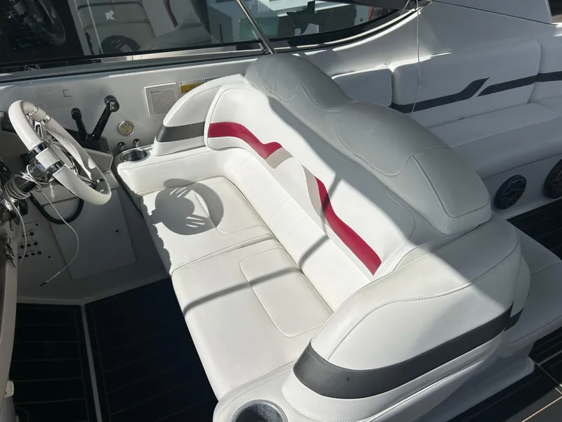Slide: The Image of 2004 Formula 400 SS boat interior with white leather seating and red accents. - 24