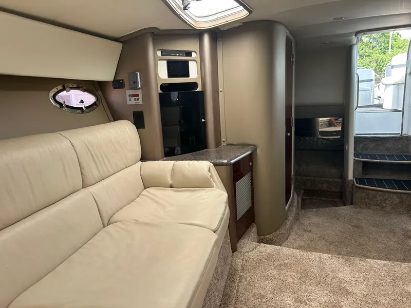 Slide: The Image of Interior of 2004 Formula 400 SS boat with beige seating and modern amenities. - 31