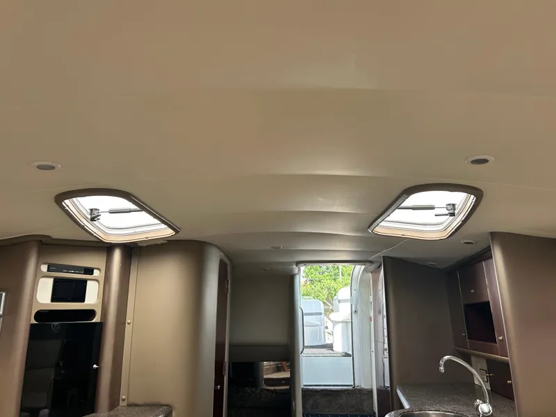 Slide: The Image of Interior of a 2004 Formula 400 SS boat with skylights and modern amenities. - 35