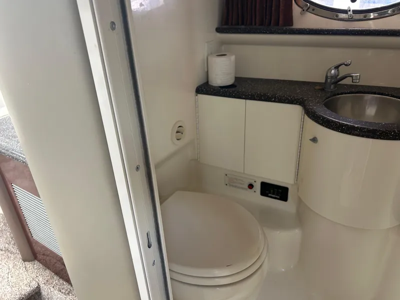 Slide: The Image of 2004 Formula 400 SS boat bathroom with toilet, sink, and countertop. - 37