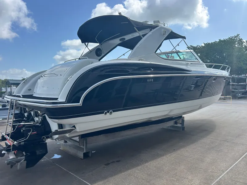 Slide: The Image of 2004 Formula 400 SS boat on a dock under a partly cloudy sky. - 4
