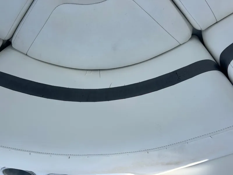 Slide: The Image of White leather seating on a 2004 Formula 400 SS boat, featuring black accents. - 42