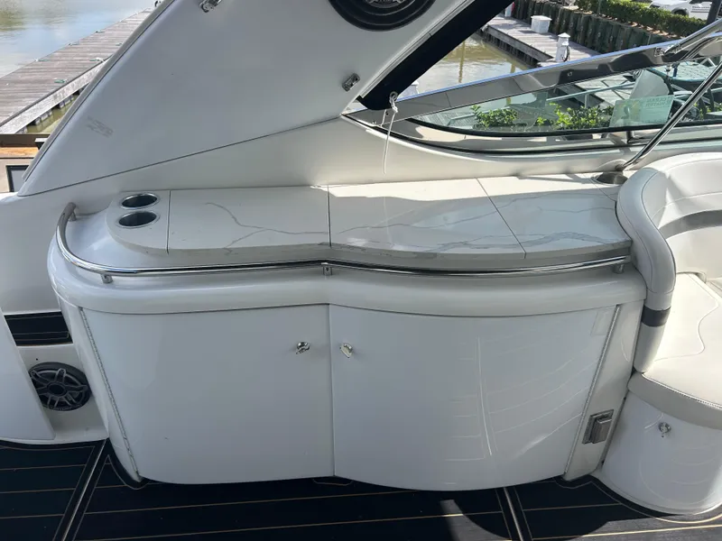 Slide: The Image of 2004 Formula 400 SS yacht interior with sleek white cabinetry and cup holders. - 44