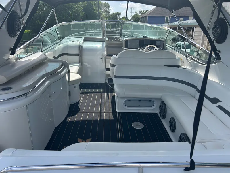 Slide: The Image of 2004 Formula 400 SS boat interior with white seating and sleek design. - 6