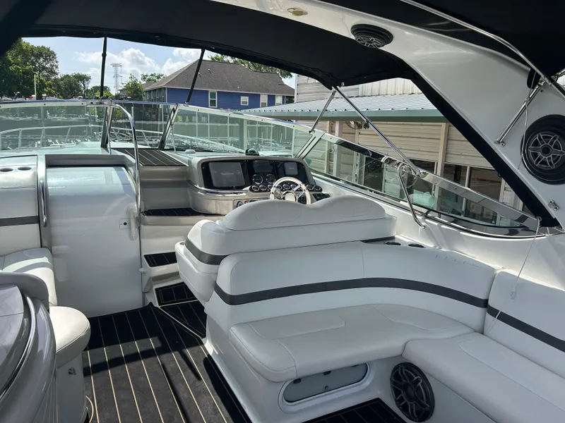 Slide: The Image of Luxurious 2004 Formula 400 SS boat interior with white seating and modern dashboard. - 9