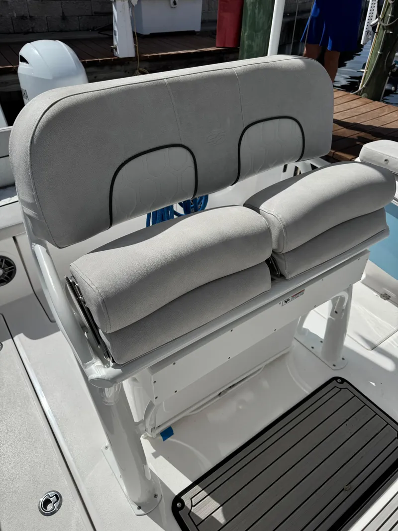 Slide: The Image of 2023 Sea Fox 268 Commander boat seating with cushioned backrest and armrests. - 12