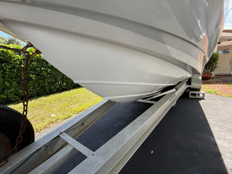 Slide: The Image of 2005 Boston Whaler 260 Outrage boat on trailer, side view. - 25