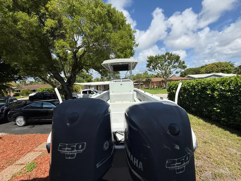 Slide: The Image of 2005 Boston Whaler 260 Outrage with twin Yamaha 250 engines, parked outdoors. - 9