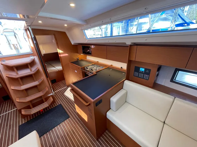 Slide: The Image of Interior of 2023 Bavaria C42 yacht with modern kitchen and seating area. - 10