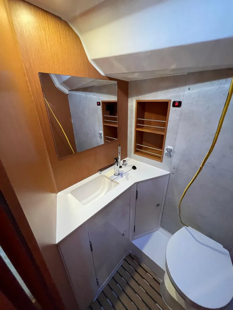 Slide: The Image of Modern bathroom in 2023 Bavaria C42 yacht with sleek sink, mirror, and storage. - 16