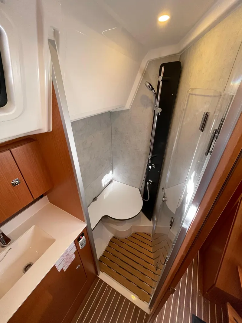 Slide: The Image of 2023 Bavaria C42 yacht bathroom with modern shower and wooden flooring. - 18