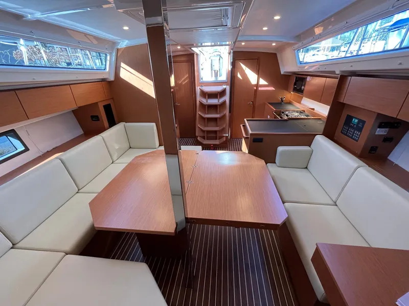 Slide: The Image of Luxurious interior of 2023 Bavaria C42 yacht with modern seating and dining area. - 5