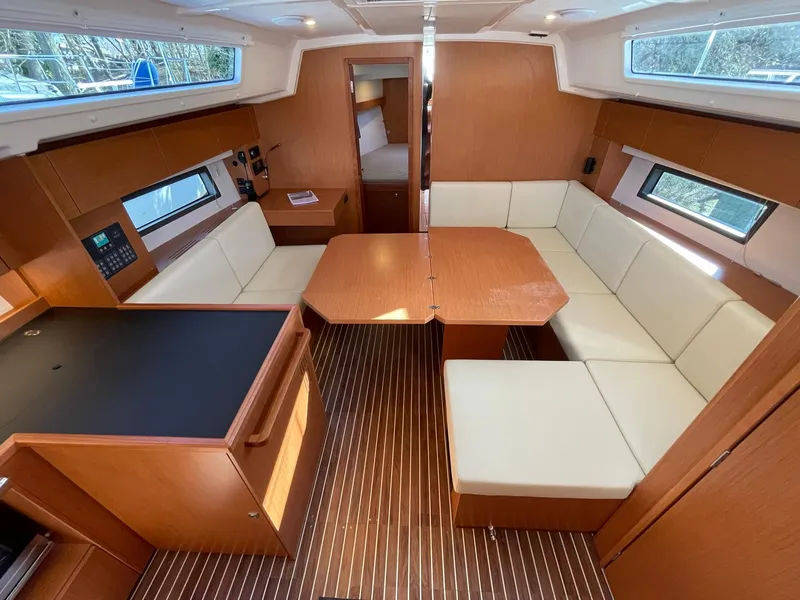 Slide: The Image of Interior of 2023 Bavaria C42 yacht with modern seating and wooden finishes. - 6