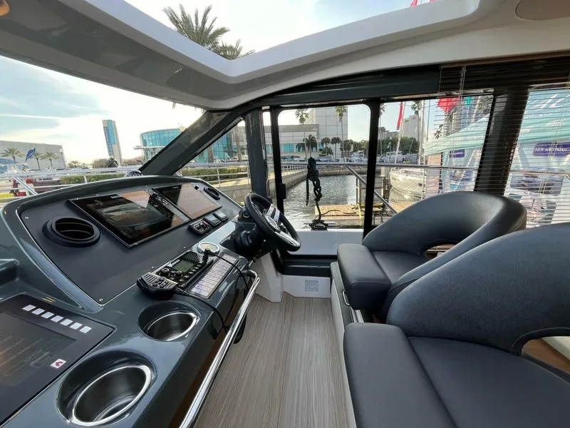Slide: The Image of Interior of 2023 Bavaria R40 Coupe yacht with modern dashboard and seating. - 4
