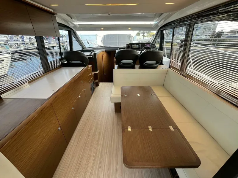 Slide: The Image of Luxurious interior of 2023 Bavaria R40 Coupe yacht with modern seating and wooden finishes. - 5