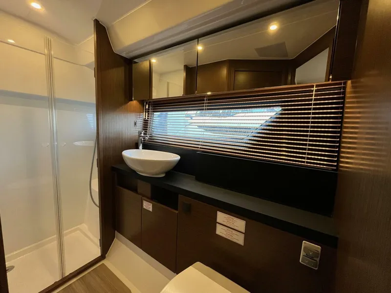 Slide: The Image of Luxurious bathroom interior of 2023 Bavaria R40 Coupe yacht with modern fixtures and elegant design. - 7