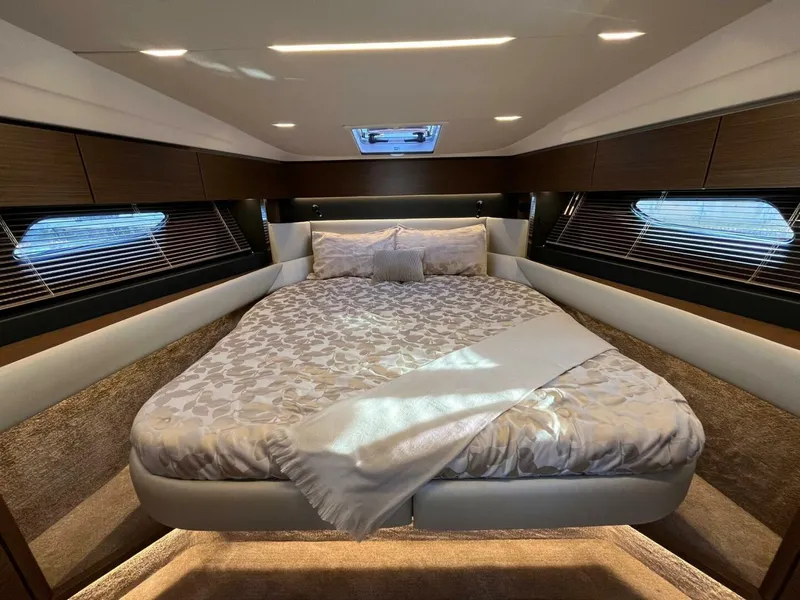 Slide: The Image of Luxurious bedroom interior of 2023 Bavaria R40 Coupe yacht with elegant bedding and ambient lighting. - 8