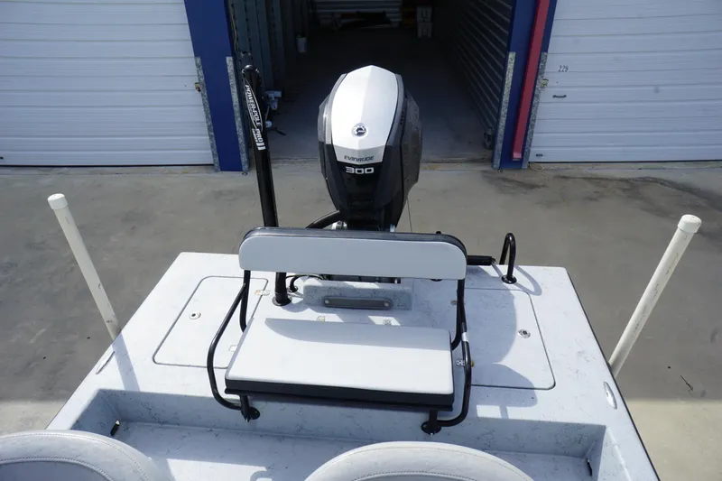 Slide: The Image of 2015 El Pescador 24 CAT boat with Evinrude 300 engine in storage facility. - 11