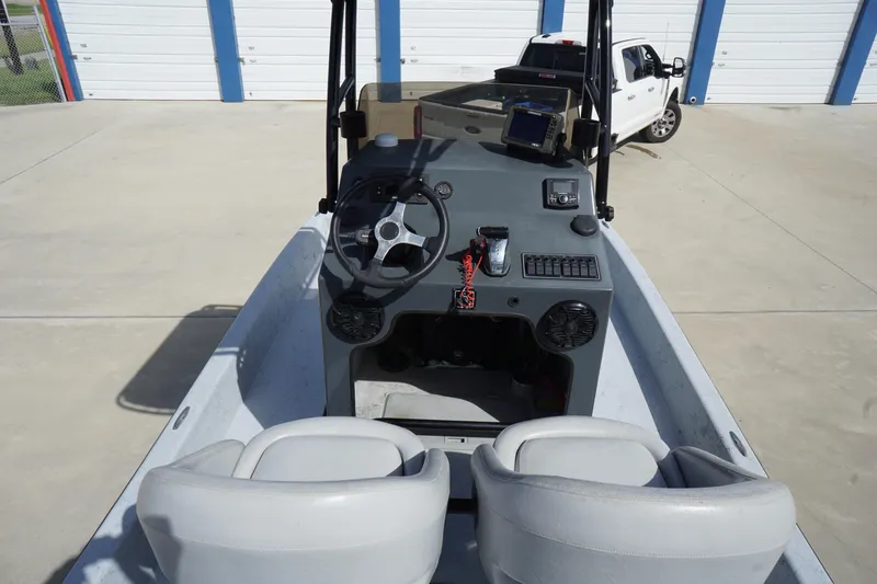 Slide: The Image of 2015 El Pescador 24 CAT boat interior with steering wheel and control panel. - 12