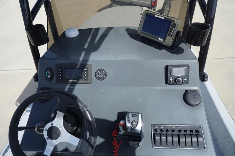 Slide: The Image of Control panel of a 2015 El Pescador 24 CAT boat with navigation equipment. - 13