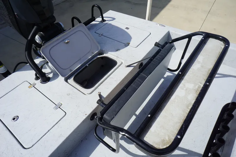 Slide: The Image of Open storage compartment on 2015 El Pescador 24 CAT boat deck. - 15