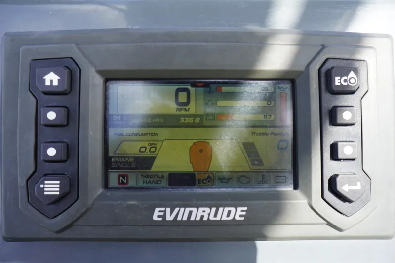 Slide: The Image of Evinrude engine display on 2015 El Pescador 24 CAT boat, showing RPM and fuel consumption. - 16