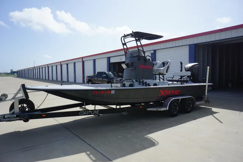 Slide: The Image of 2015 El Pescador 24 CAT boat on trailer, parked outside storage facility. - 3
