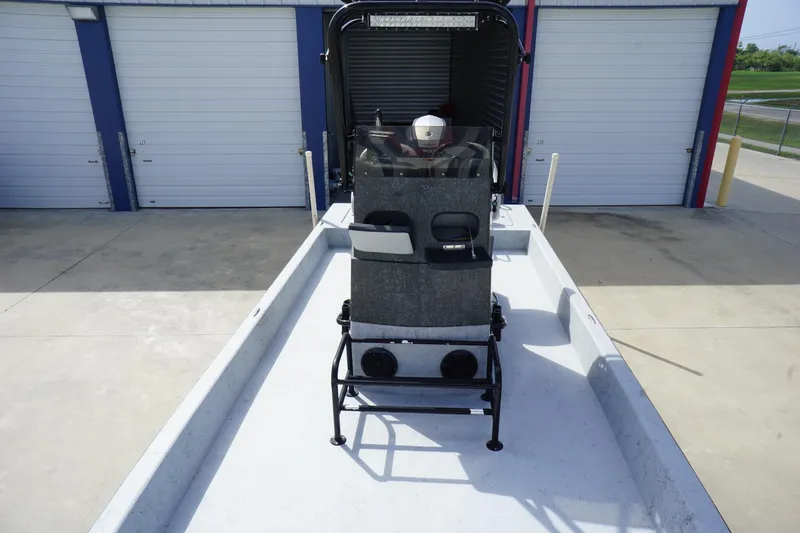 Slide: The Image of 2015 El Pescador 24 CAT boat in storage facility, rear view. - 8