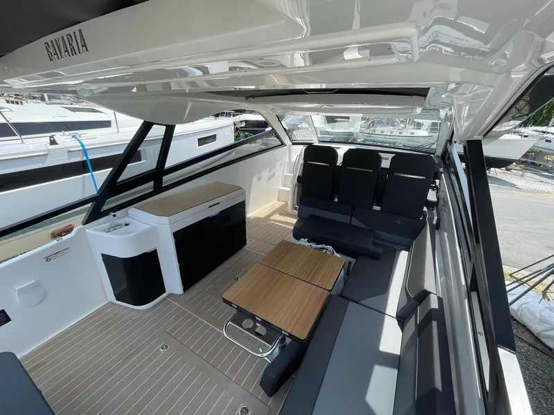 Slide: The Image of 2023 Bavaria Vida 33 boat interior with seating, table, and kitchenette. - 10