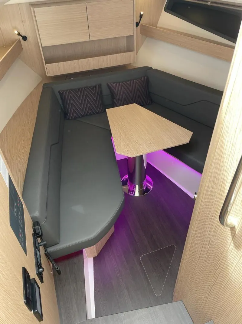 Slide: The Image of Modern interior of 2023 Bavaria Vida 33 yacht with cozy seating and ambient lighting. - 13
