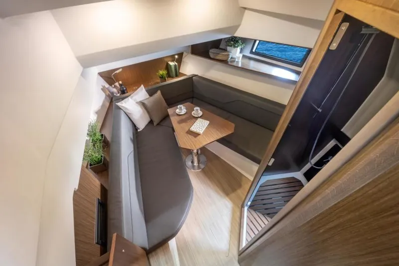Slide: The Image of Luxurious interior of 2023 Bavaria Vida 33 yacht with cozy seating and elegant decor. - 14
