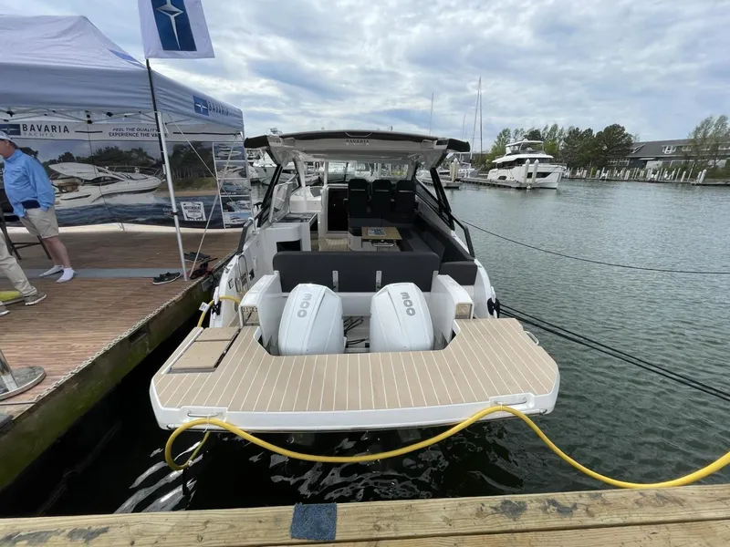 Slide: The Image of 2023 Bavaria Vida 33 yacht docked at marina, showcasing sleek design and powerful engines. - 4