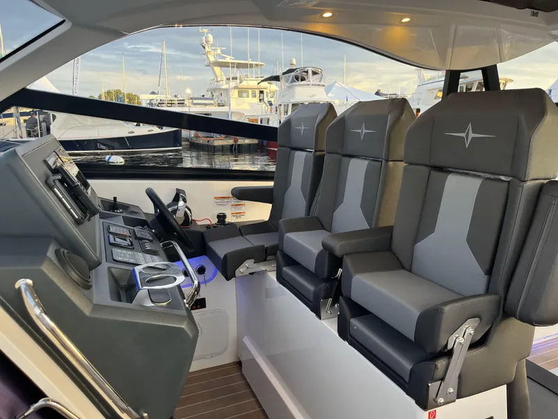 Slide: The Image of Interior of 2023 Bavaria Vida 33 boat with modern helm and seating. - 7