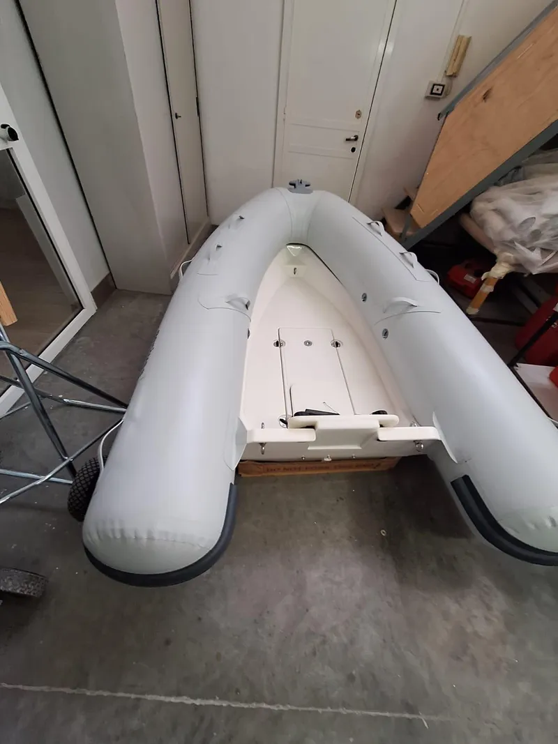 Slide: The Image of Inflatable boat Geniuss 380 HTS 2022 model in a garage setting. - 17